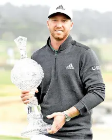  ?? - AFP photo ?? Berger celebrates with the trophy after winning during the final round of the AT&T Pebble Beach Pro-Am.