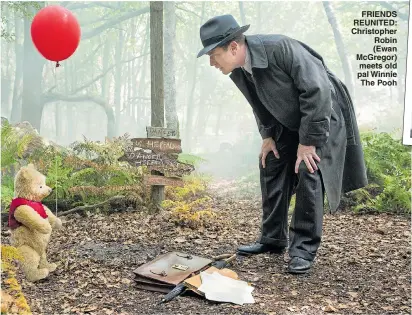  ??  ?? FRIENDS REUNITED: Christophe­r Robin (Ewan McGregor) meets old pal Winnie The Pooh