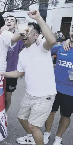  ?? ?? 0 Tens of thousands of Rangers fans made their way to Seville for the game and these supporters are thoroughly enjoying the baking sunshine that greeted them and, left, manager Giovanni van Bronckhors­t addresses the media ahead of the final