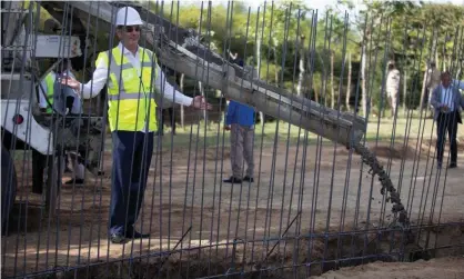  ?? Photograph: Reuters ?? The Dominican Republic's president, Luis Abinader, in Dajabón as constructi­on begins on the wall that will span nearly half the 244-mile border with Haiti.