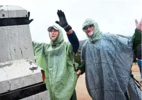  ??  ?? Forry (left) and Lichter celebratin­g after completing their hazardous journey at the Mexican border near campo. — aP