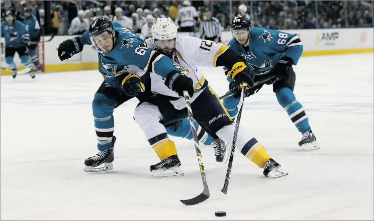  ?? — GETTY IMAGES FILES ?? Mike Fisher of the Nashville Predators, centre, battles with Justin Braun of the San Jose Sharks during Game 5 Saturday in San Jose. The Sharks won 5-1.