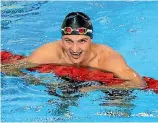  ?? GETTY IMAGES ?? Gold medalist Sophie Pascoe, left, poses during the medal ceremony for the women’s SM10 200m individual medley final while fellow competitor Lewis Clareburt was all smiles after finishing seventh in the men’s 200m butterfly final.