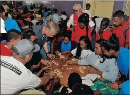  ?? PICTURES: BRUCE SUTHERLAND ?? Scrabble calls for focused attention from all.