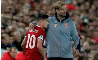  ?? — Reuters ?? Liverpool manager Juergen Klopp with Philippe Coutinho during the game on Wednesday.