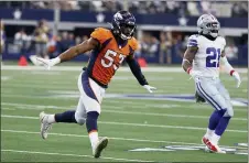 ?? MICHAEL AINSWORTH — THE ASSOCIATED PRESS ?? Denver linebacker Jonathon Cooper, left, had a lot to celebrate last week at Dallas, including his first two career sacks.