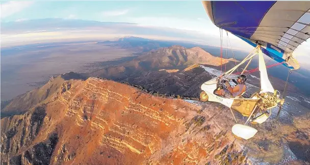  ?? COURTESY OF JEFF GILKEY ?? Jeff Gilkey flies his ultralight trike over the Manzano Mountains at sunset in the fall of 2016. On Wednesday, he is presenting a program titled “Secrets of New Mexico: Views From An Ultralight Pilot” at the New Mexico Museum of Natural History and...