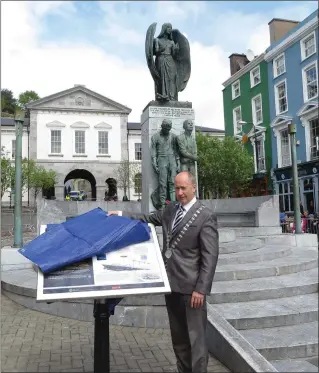  ??  ?? Mayor of County Cork Cllr Alan Coleman officially unveils the Lusitania heritage/tourist informatio­n sign in Cobh on May 7, said sign having been undertaken by the Heritage Unit of Cork County Council with the support of the Heritage Council.