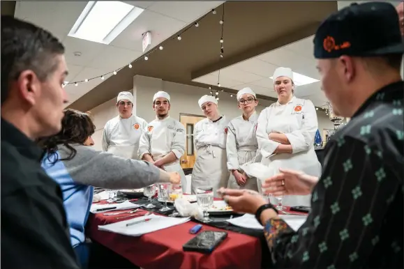  ?? NATHAN BURTON/Taos News ?? The Taos High Culinary Arts team receives feedback and critique from local chef’s Tuesday (April 4) at Taos High School during the program’s fundraisin­g event.