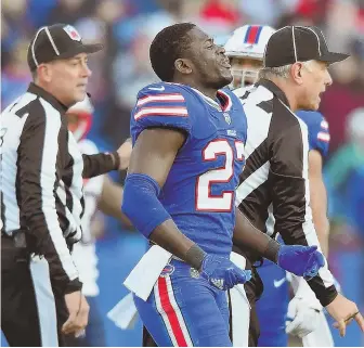  ?? STAFF PHOTO BY CHRISTOPHE­R EVANS ?? NOT HAPPY: Bills defensive back Tre’Davious White leaves the field after taking a late hit from Rob Gronkowski in Sunday’s game.