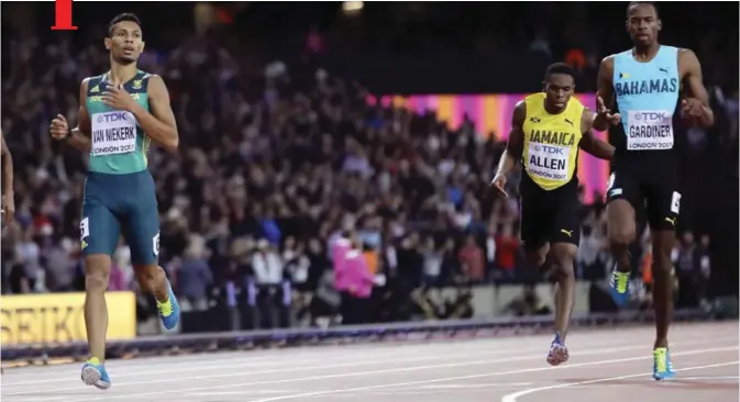  ??  ?? LONDON: South Africa’s Wayde Van Niekerk, left, crosses the line to win the gold medal in the Men’s 400m final ahead of Bahamas’ Steven Gardiner, right, who took bronze during the World Athletics Championsh­ips in London Tuesday. — AP