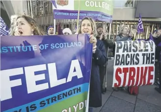  ?? PICTURE: JEFF J MITCHELL/GETTY IMAGES ?? Further education lecturers hold a rally outside the Scottish Parliament