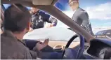  ?? SOURCE: YOUTUBE ?? A screenshot from a video shows a New Mexico State Police officer breaking out a car window during a February traffic stop in Taos County.