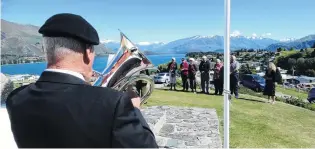  ?? PHOTO: MARK PRICE ?? Regimental tradition . . . In Wanaka the the Last Post and Reveille were played by David Leslie, of Wanaka, formerly of Gore, on his euphonium.