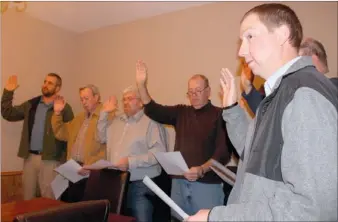  ?? LYNN KUTTER ENTERPRISE-LEADER ?? Doug Stumbaugh, right, is the newest member of the Prairie Grove City Council. He takes the oath of office Jan. 7, along with council members Dale Reed, left, Buddy Lyle, Rick Clayton, Tony Cunningham, Marquita Smith and Doug Bartholome­w. Alderman...