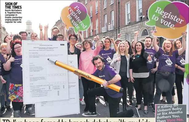  ??  ?? SIGN OF THE TIMES Kevin Mcgahern & Together4y­es campaign in Dublin yesterday urging people to register for vote