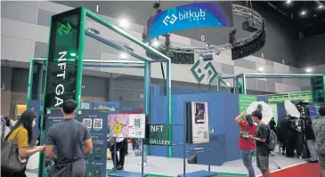  ?? ?? People check out Bitkub’s booth at the recent Thailand Crypto Expo 2022.