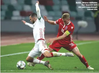  ??  ?? Battle...Belarus midfielder ihar Stasevich (left) vies with luxembourg’s laurent Jans