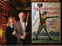  ?? JAY JANNER / AMERICAN-STATESMAN ?? Terry Todd, with his wife, Jan, holds a baseball bat that belonged to Frank Chance of the Chicago Cubs in the early 1900s at the Stark Center for Physical Culture and Sports in 2007. The poster is an original 1904 advertisem­ent.