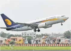  ??  ?? A Jet Airways passenger aircraft takes off from the airport in the western Indian city of Ahmedabad, India. — Reuters photo
