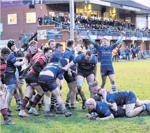  ?? Rob Hockney ?? Macclesfie­ld celebrate a try during the clash against Ilkley at Priory Park in January this year