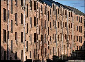  ??  ?? Tenement flats in Glasgow