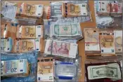  ??  ?? €135,000 in various currencies was recovered during the house search.