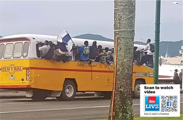  ?? ?? Students misbehavin­g on a Central Transport bus hanging out of the window and being rowdy on April 19, 2023.