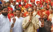  ?? — PTI ?? Shiv Sena chief Uddhav Thackeray with party leaders Aditya Thackeray and Eknath Shinde visit the Thane Municipal Corporatio­n to congratula­te newly-appointed mayor Naresh Mhaske on Thursday.