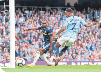  ??  ?? Raheem Sterling of Manchester City scores his team’s third goal