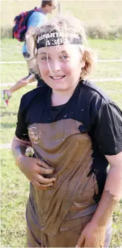  ??  ?? Will Maclean of Yarragon shows his thrill after coming out of the mud pit.