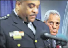  ?? SCOTT OLSON / GETTY IMAGES ?? Chicago Mayor Rahm Emanuel listens as Police Superinten­dent Eddie Johnson speaks at a press conference called by U.S. Attorney General Loretta Lynch Friday in Chicago.