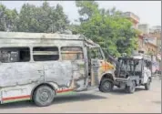  ?? PTI ?? A charred ambulance being towed away during relaxation of curfew in Jaipur on Tuesday.