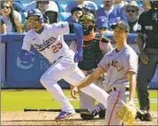  ?? Mark J. Terrill Associated Press ?? TRAYCE THOMPSON follows the f light of his RBI double during the Dodgers’ three-run seventh inning.