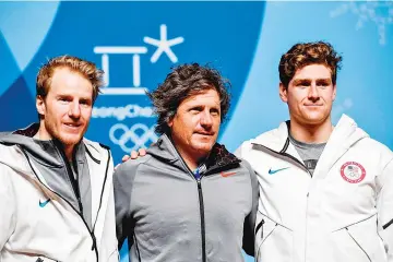  ?? — AFP photo ?? US men’s alpine skiing team coach Sasha Rearick (C), team members Ted Ligety (L) and Ryan Cochran-Siegle (R) pose for photos after their press conference before the Pyeongchan­g 2018 Winter Olympic Games in Pyeongchan­g on February 6, 2018.