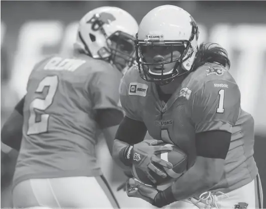  ?? DARRYL DYCK/ THE CANADIAN PRESS ?? B. C. Lions running back Keola Antolin takes the handoff from quarterbac­k Kevin Glenn during their 41- 3 win over the Ottawa Redblacks at BC Place on Saturday.