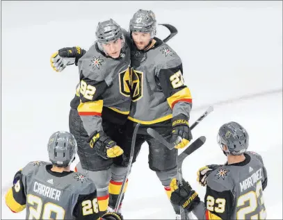  ?? Jason Franson The Associated Press ?? Tomas Nosek, top left, Shea Theodore, top right, celebrate a goal against Chicago on Thursday. Nosek was playing in place of Max Pacioretty, who is out with a lingering injury. Nosek suffered an injury of his own and might miss Game 3.