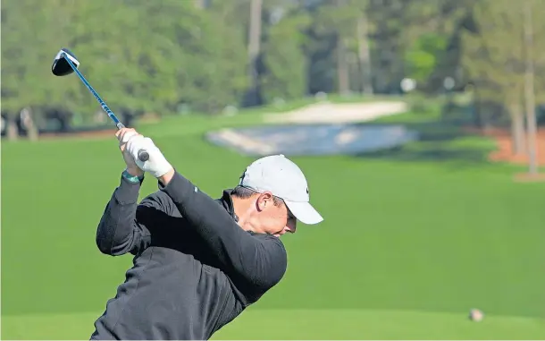  ??  ?? OPENING BID: Rory McIlroy on the first tee during a practice round at Augusta National yesterday.