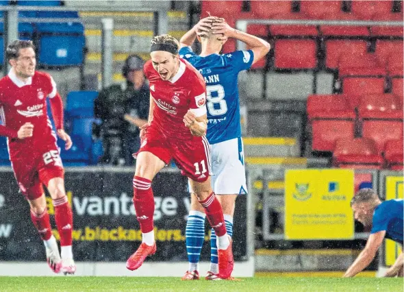  ?? Picture: SNS. ?? Aberdeen’s Ryan Hedges celebrates his winning goal as the Dons emerge from their mini-shutdown by winning in Perth.