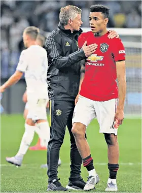  ??  ?? Protective arm: Ole Gunnar Solskjaer has gone on the counter-attack for Mason Greenwood