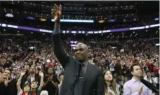  ?? RICK MADONIK/TORONTO STAR ?? Former Raptor Charles Oakley acknowledg­es the crowd back in March on his bobblehead day. “I have a head, so you never know what could happen.”