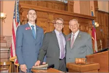  ??  ?? State Rep. Trey Kelley (from left), his father and local coach and pastor Doyle Kelley, and State House Speaker David Ralston pose together for a photo after Doyle Kelley was Chaplain for the Day.