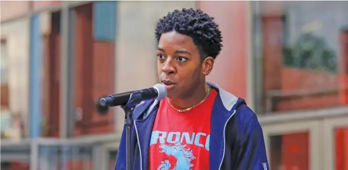  ?? KIRSTEN STICKNEY/ SUN- TIMES ?? Senior defensive back Myles Mooyoung, formerly of Kenwood, speaks last month outside the Thompson Center as part of a protest of the postponeme­nt of fall high school sports in Illinois.