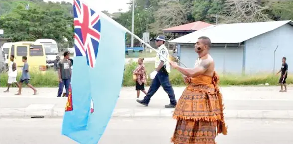  ??  ?? Fijian flag bearer at the 2018 Melanesian Arts and Cultural Festival (MACFEST) opening in Honiara, Solomon Islands. Photo: DEPTFO.