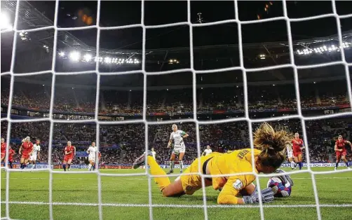  ?? Richard Heathcote / Getty Images ?? U.S. goalkeeper Alyssa Naeher smothers a penalty kick by England’s Steph Houghton in the 85th minute of Tuesday’s semifinal match.