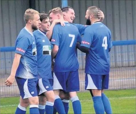  ??  ?? 4 0 Happy days as Leek Town players celebrate Jordan Johnson’s goal against Ramsbottom. Picture and report: Steve Reynolds