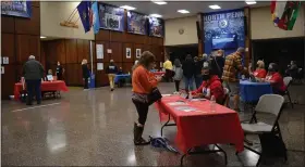  ?? RACHEL RAVINA — MEDIANEWS GROUP ?? People check in Sunday morning to a COVID-19vaccinat­ion clinic inside of North Penn High School in Lansdale. The initiative, created by Skippack Pharmacy, aims to inoculate 3,500people in the priority 1A group.