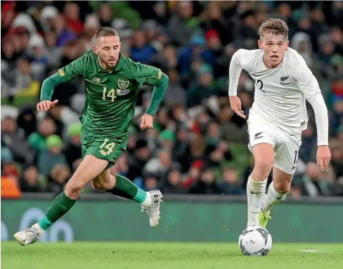  ?? INPHO/PHOTOSPORT ?? Callum McCowatt, right, who scored the All Whites’ goal, looks to break clear of Conor Hourihane in the 3-1 loss to Ireland in Dublin.