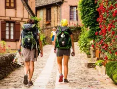  ??  ?? Above: pilgrims walking the Camino de Santiago