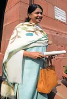  ?? — G. N. JHA, PTI ?? BJP chief Amit Shah ( left) and DMK MP Kanimozhi at the Parliament House during the Winter Session in New Delhi on Friday.